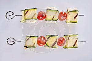 Healthy grilled haloumi cheese and tomato kebabs photo