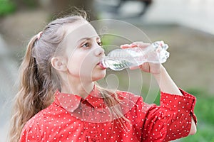 Healthy habits. Healthy and hydrated. Girl care about health and water balance. Girl cute kid hold water bottle. Water