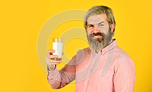 Healthy habits. Lactose free. Vegan milk concept. Bearded man hold glass of milk. Pasteurized milk. Vegan milks made photo