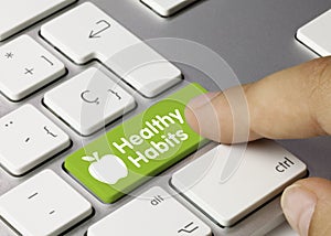 Healthy habits - Inscription on Green Keyboard Key photo