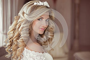 Healthy hair. Beautiful smiling girl bride with long blonde curl