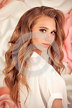 Healthy hair. Wavy long hairstyle. Back view of Blond hair styling. Wedding day. Bride. High Fashion Coiffure. Close Up of Hairdo