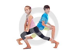 Kids doing leg strengthening and flexibility exercises photo