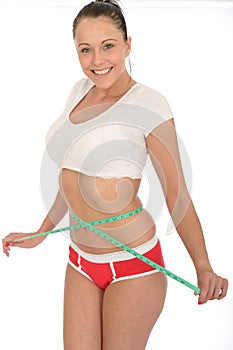 Healthy Happy Pleased Young Woman Checking Her Weight Loss With a Tape Measure