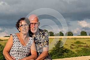 Healthy happy senior couple, outdoors and sunrise