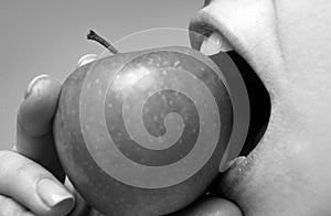 Healthy happy woman eating apple close macro. Biting an apple. Mouth close up. Dental Care.