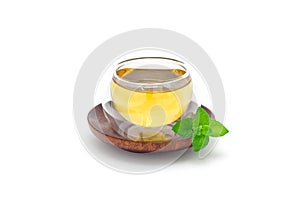 Healthy herbal mint tea in oriental glass cup isolated on white, horizontal