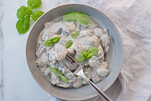 Healthy home made gnocchi with mushrooms and basil