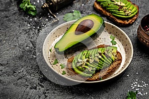 Healthy homemade avocado on toast bread with spices. Vegetarian food. Plant-based diet. Clean eating. Detox and healthy superfoods