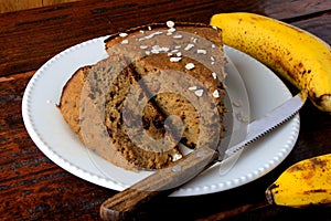 Healthy homemade banana cake made with oatmeal on rustic wooden table. sugar-free, milk-free, gluten-free