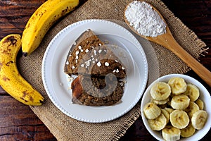 Healthy homemade banana cake made with oatmeal on rustic wooden table. sugar-free, milk-free, gluten-free