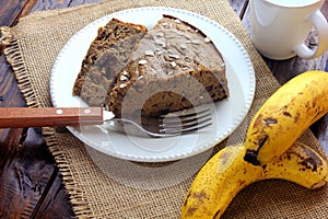 Healthy homemade banana cake made with oatmeal on rustic wooden table. sugar-free, milk-free, gluten-free