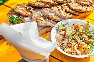 Healthy homemade biscuits from oat flakes laid on orange table