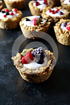 Healthy homemade granola cups with Greek yogurt and berries