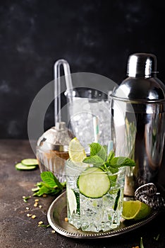 Healthy homemade lemonade with cucumber, basil, lemon, honey and sparkling water,