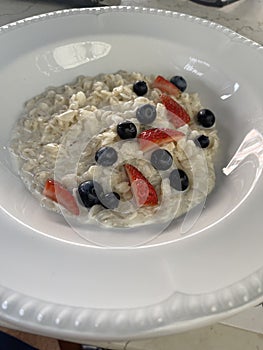 Healthy homemade oatmeal with berries for breakfast