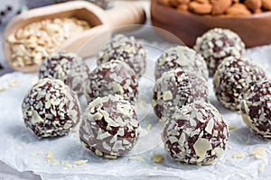 Healthy homemade paleo chocolate energy balls on parchment, horizontal