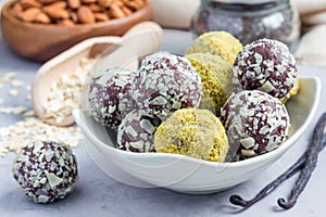 Healthy homemade paleo chocolate energy balls on plate, horizontal