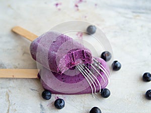 Healthy homemade raw vegan blueberry ice cream on stick with cashew, healthy vegetarian diet vegan raw fruit organic