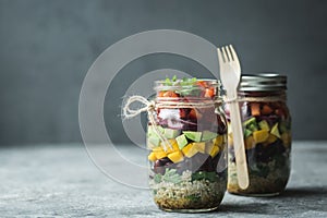 Healthy homemade salad in mason jar with quinoa and vegetables. Healthy food, clean eating, diet and detox. Copy space