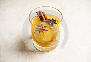 Healthy hot beverage with lemon, ginger and spices for protection in flu season