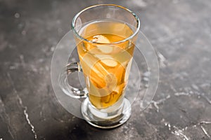 Healthy hot beverage with lemon, ginger and spices for protection in flu season