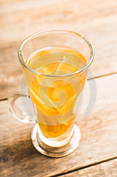 Healthy hot beverage with lemon, ginger and spices for protection in flu season