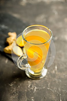 Healthy hot beverage with lemon, ginger and spices for protection in flu season