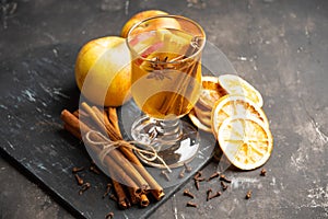 Healthy hot beverage with oranges, apples and spices for protection in flu season