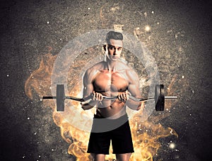 Healthy hot male showing muscles with fire