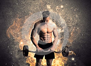 Healthy hot male showing muscles with fire