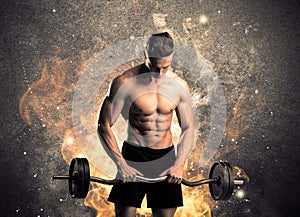 Healthy hot male showing muscles with fire