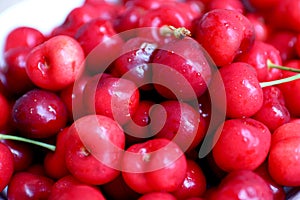 Healthy, juicy, fresh, organic cherries in fruit bowl close up. Cherries in background.