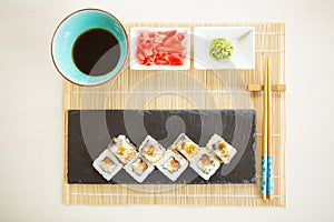 Healthy kale and avocado sushi roll with chopsticks. Sushi menu. Japanese food