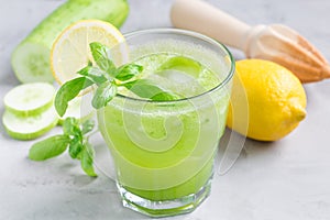 Healthy lemonade with cucumber, basil, lemon, honey and sparkling water, horizontal