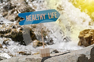 Healthy life sign board on rock