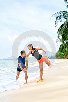 Healthy Lifestyle. Athlete Stretching, Exercising On Beach. Fitness, Athletics, Sports