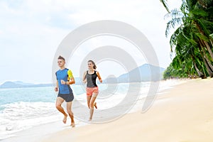 Healthy Lifestyle. Athletic Couple Running On Beach. Sports, Fit