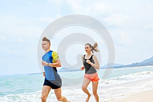 Healthy Lifestyle. Athletic Couple Running On Beach. Sports, Fit