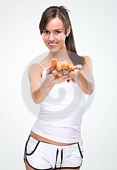 Healthy lifestyle! Beautiful woman holding carrot