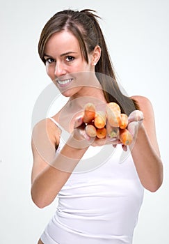 Healthy lifestyle! Beautiful woman holding carrot