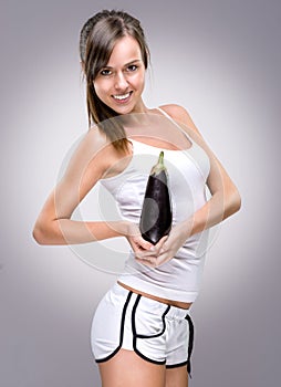 Healthy lifestyle! Beautiful woman holding eggplant