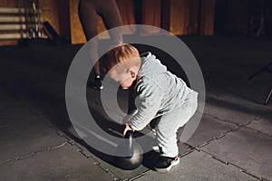 Healthy lifestyle child exercising dumbbell weight sport.