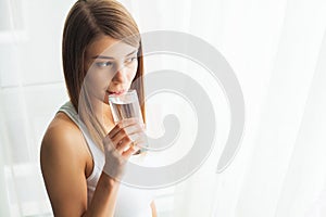 Healthy Lifestyle. Close-up Portrait Of Young Woman Drinking Refreshing Pure Water From Glass. Healthcare. Drinks. Water