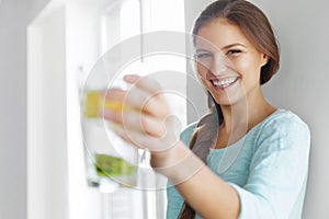 Healthy Lifestyle Concept, Diet And Fitness. Woman Drinking Water With Lemon , Lime And Mint