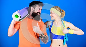 Healthy lifestyle concept. Man and woman with yoga mat and sport equipment. Fitness exercises. Workout and fitness. Girl