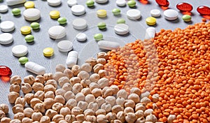 Healthy lifestyle concept. Medicine microelements in lentils and chickpeas. Pills and beans