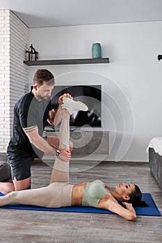 Healthy lifestyle, concept. Sporty caucasian couple exercising at home together