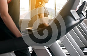 Healthy lifestyle concept,Young teen woman walk and running on treadmills doing cardio training indoor center,Close up