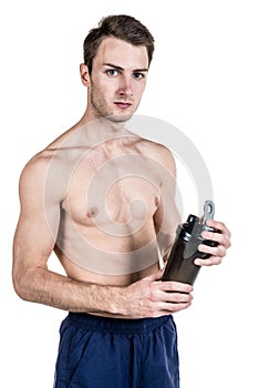 Healthy lifestyle and fitness. Handsome guy sports a physique, with a naked body, with a bottle of water in his hands, isolated on